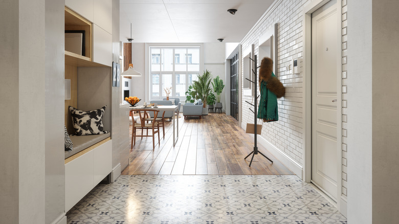 A foyer opening up to a living room