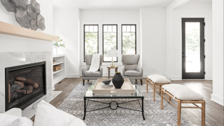 Open concept living room separated from foyer with benches