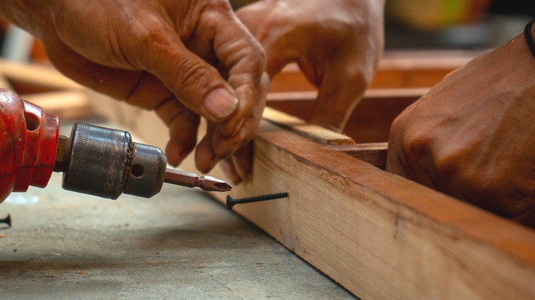 men assembling wood frame