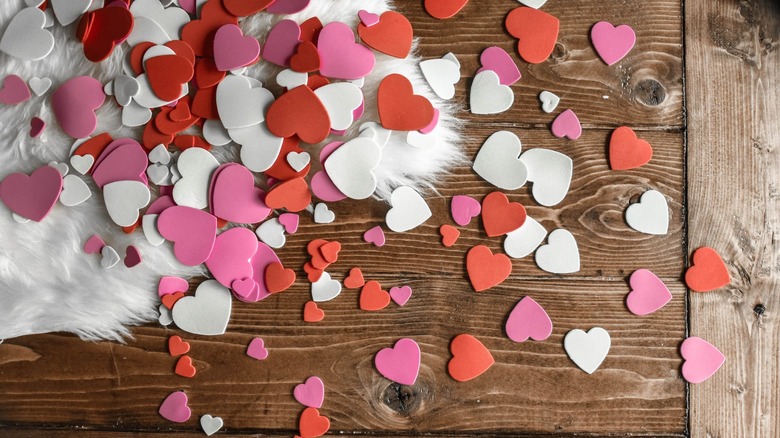 paper hearts on wooden table