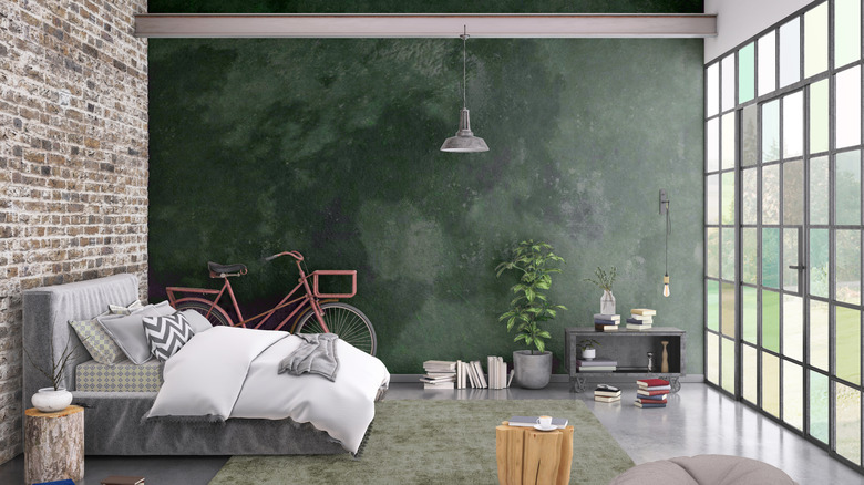 Green textured concrete wall in a bedroom