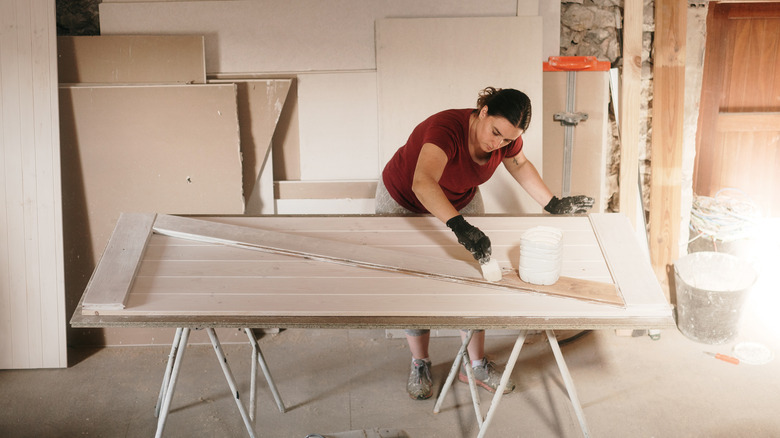 woman crafting a barn door