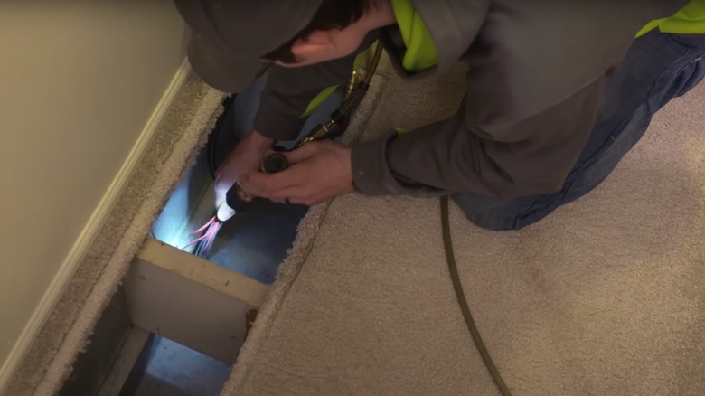 man removing dust in vents