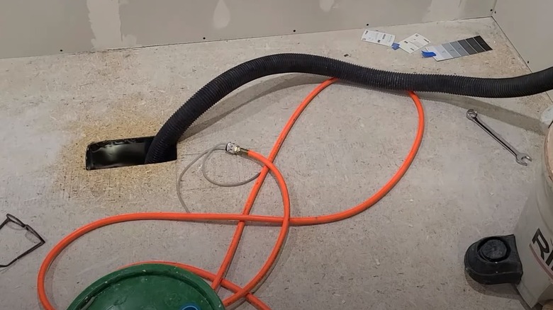 Wet-dry vac removing dust