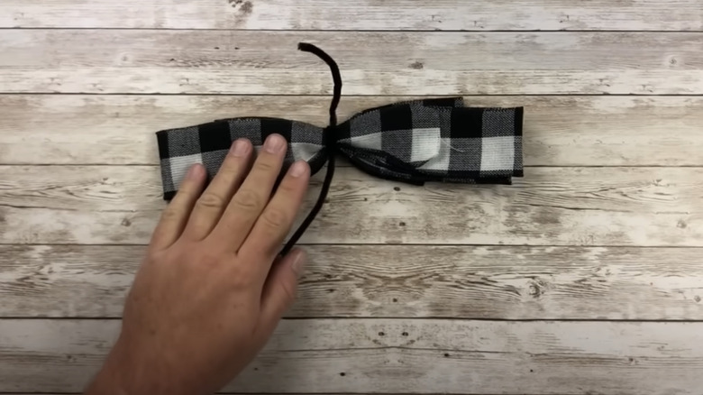 person making a bow