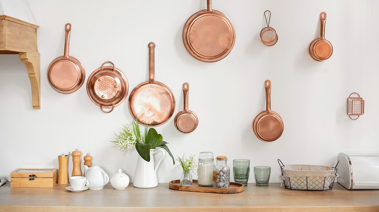 pots and pans on wall