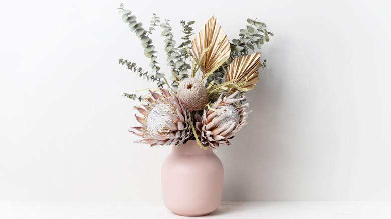 Pink vase with dried flowers