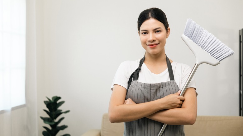 Woman holding a broom