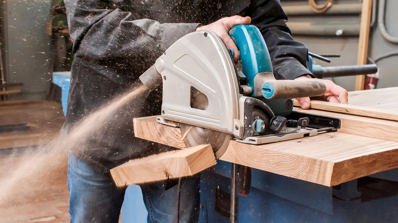 cutting wood with a saw 