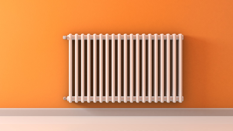 radiator in front of orange wall