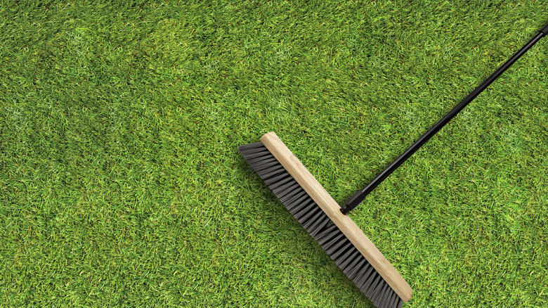 Stiff broom on top of artificial turf