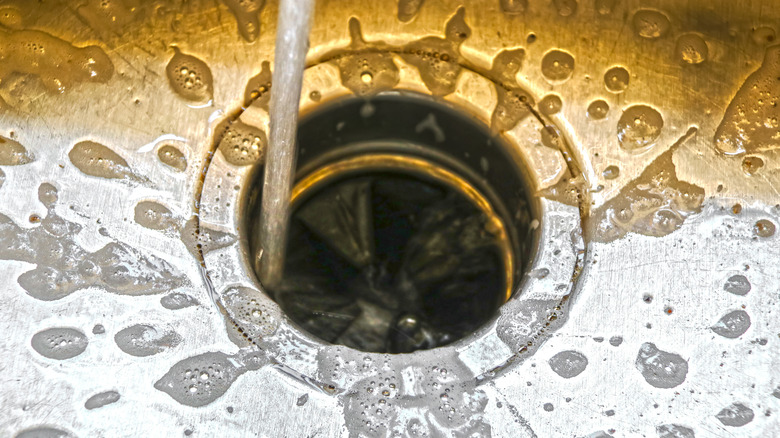 Water running down sink drain