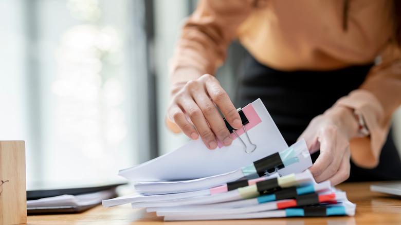 person sorting papers