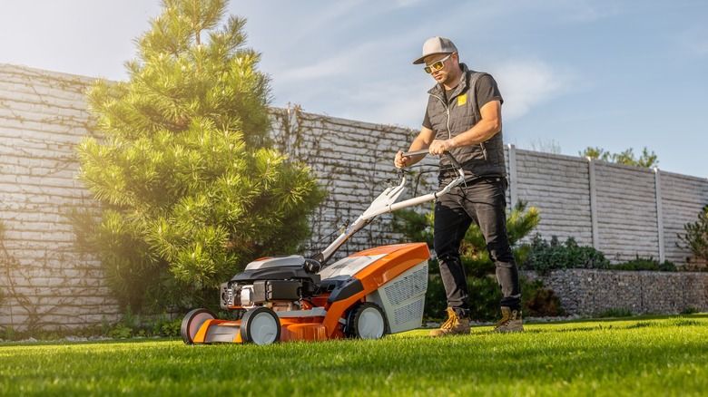 man mowing lawn