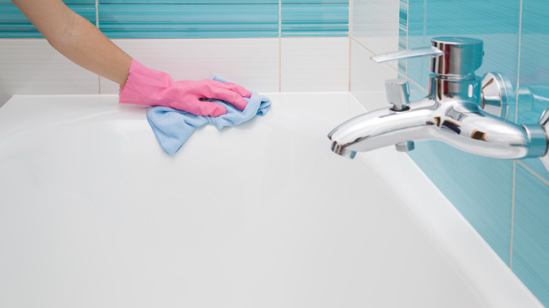 Hand scrubbing a bathtub