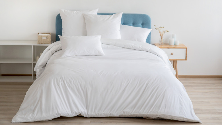 bed with white linen sheets