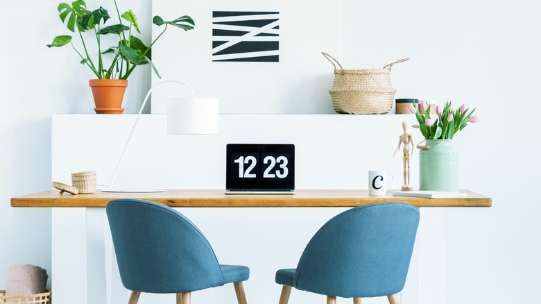 Desk with two blue chairs