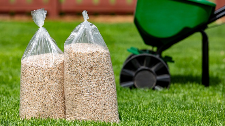 bags of fertilizer on lawn