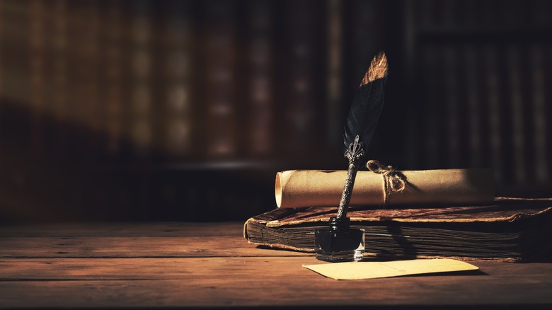 quill on table in library