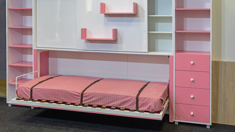 Pink kids fold out bed