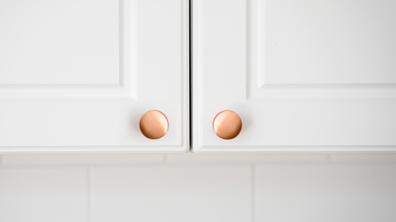 copper knobs white cabinet