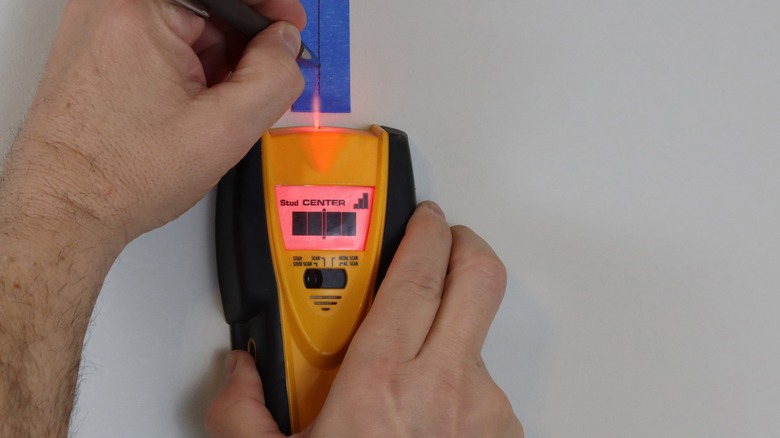 Stud finder in use