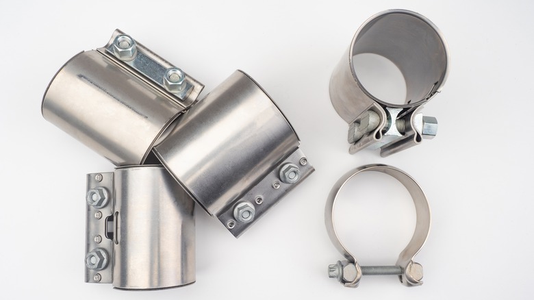 Five metal plumbing clamps