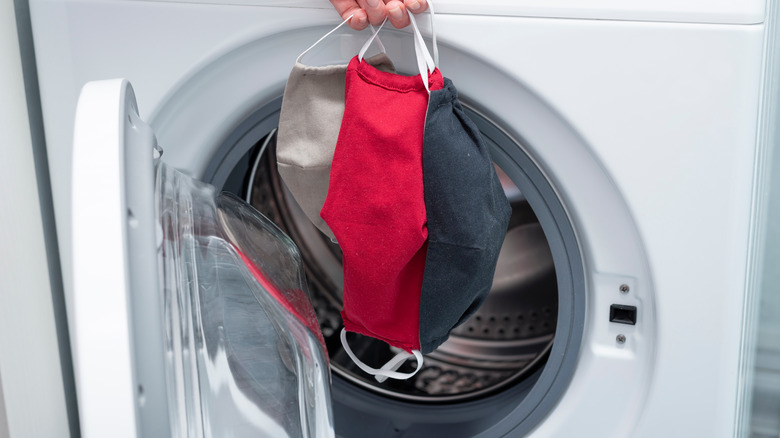 Masks in front of washer safety latch