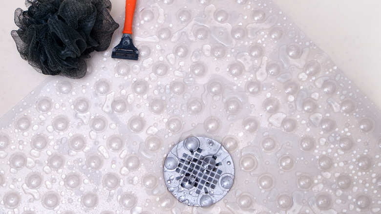 Shower mat over drain