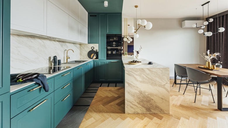 Contemporary kitchen with teal cabinets