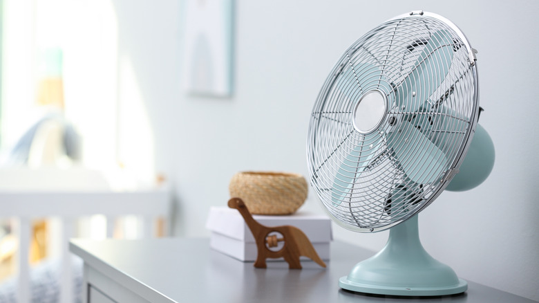 a fan on a dresser