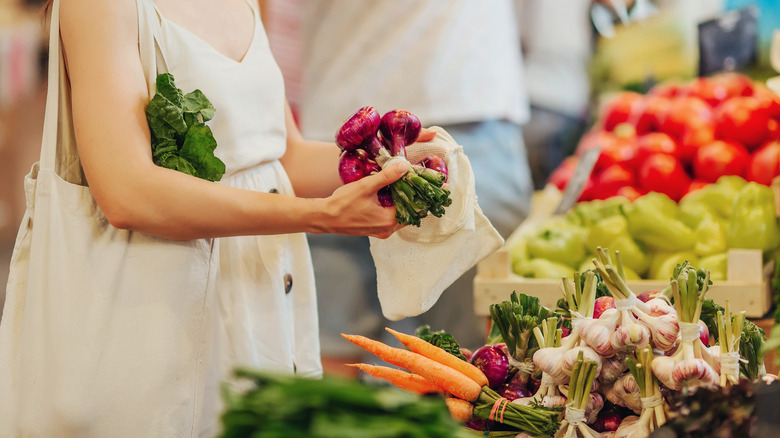 woman white dress produce shopping