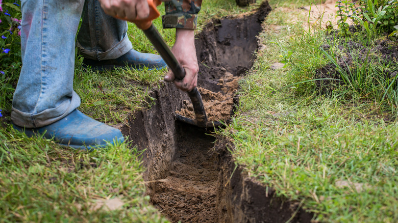 Man digging a ditch