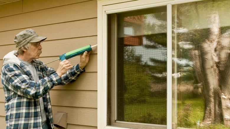 sealing window with caulk