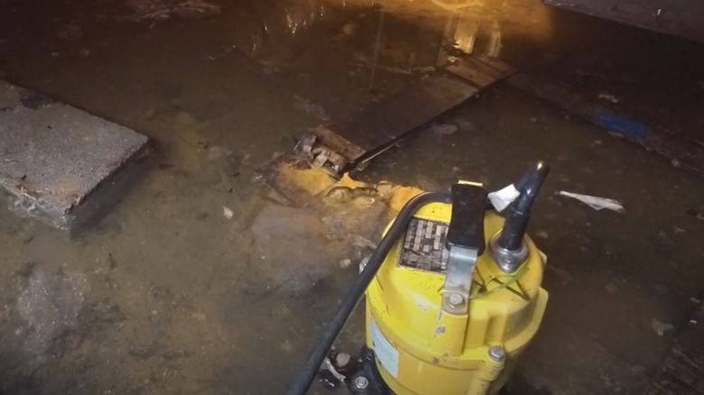 pump removing water from a crawl space