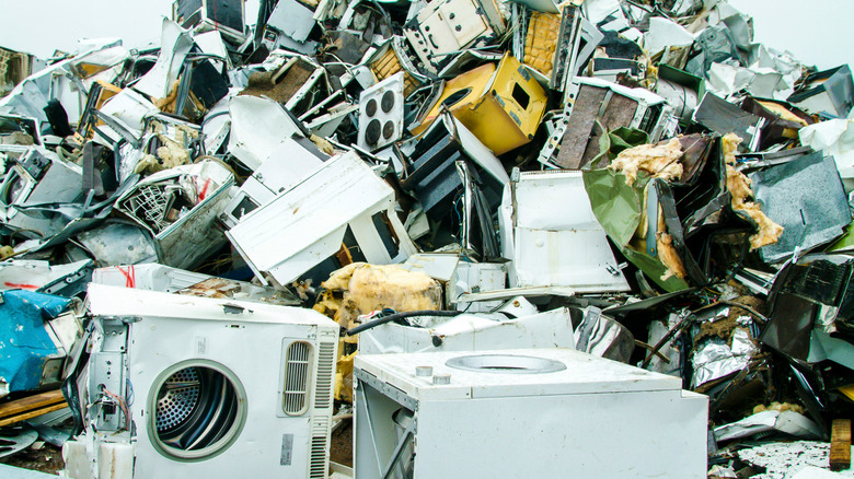 Appliances in pile at recycling center 