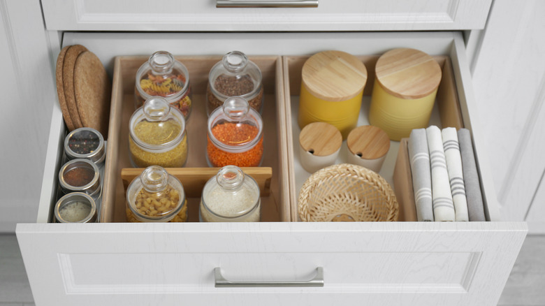 Organized drawers with glass jars