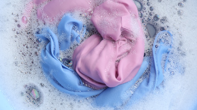 clothes soaking in soapy water