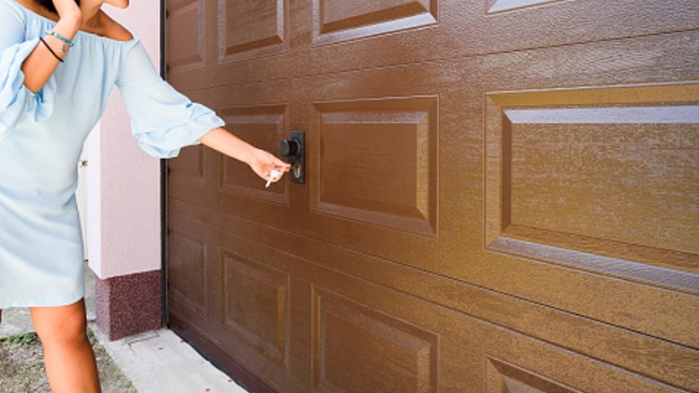 Person unlocking garage door