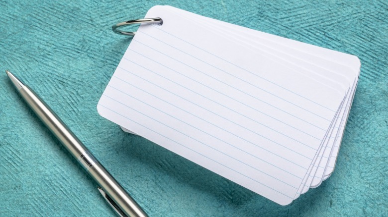 Index cards, pen, blue background