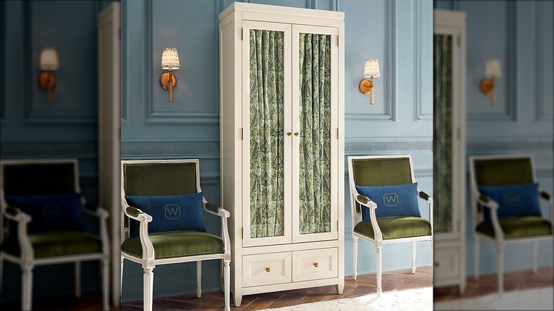 Glass storage cabinet with patterned fabric in the window