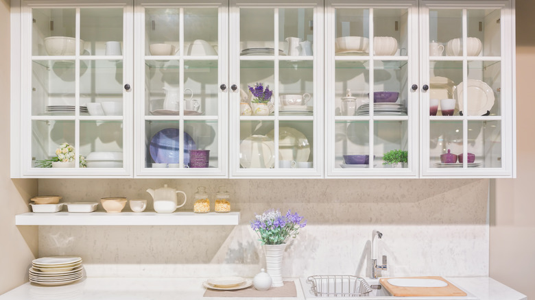 Kitchen with large glass cabinets.