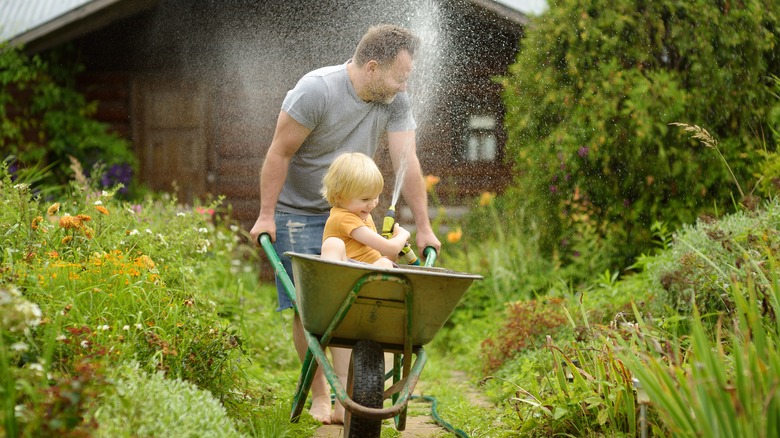 father and son in garden