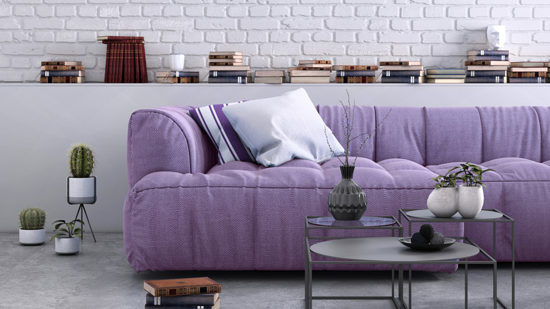 Living room with purple sofa