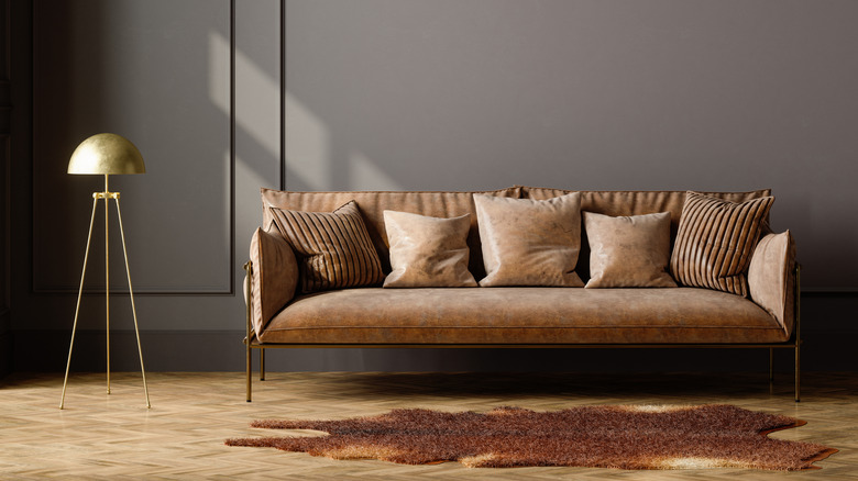 Brown sofa in room with earth tones