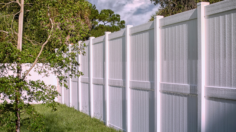 An 8-foot-tall privacy fence with vinyl posts and panels