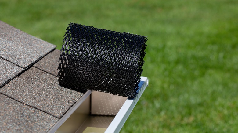 Installing a gutter guard mesh screen