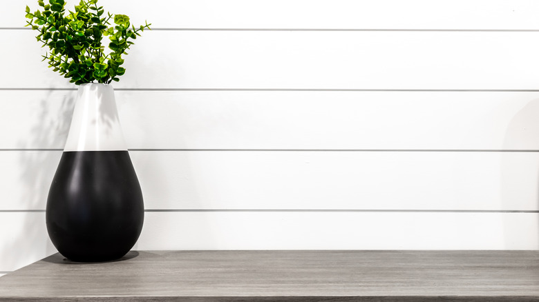 grey table and shiplap wall