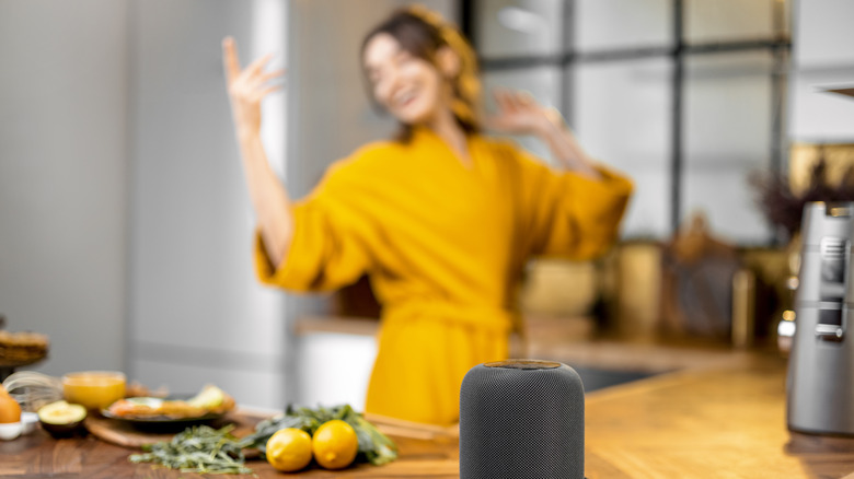 Person listening to kitchen speaker