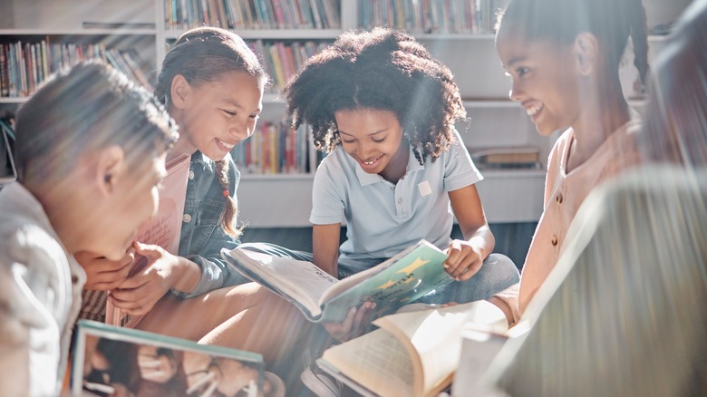 Group of kids reading books together